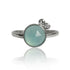 Sterling silver ring featuring aqua chalcedony and white topaz gemstones, showcasing elegant jewelry design.