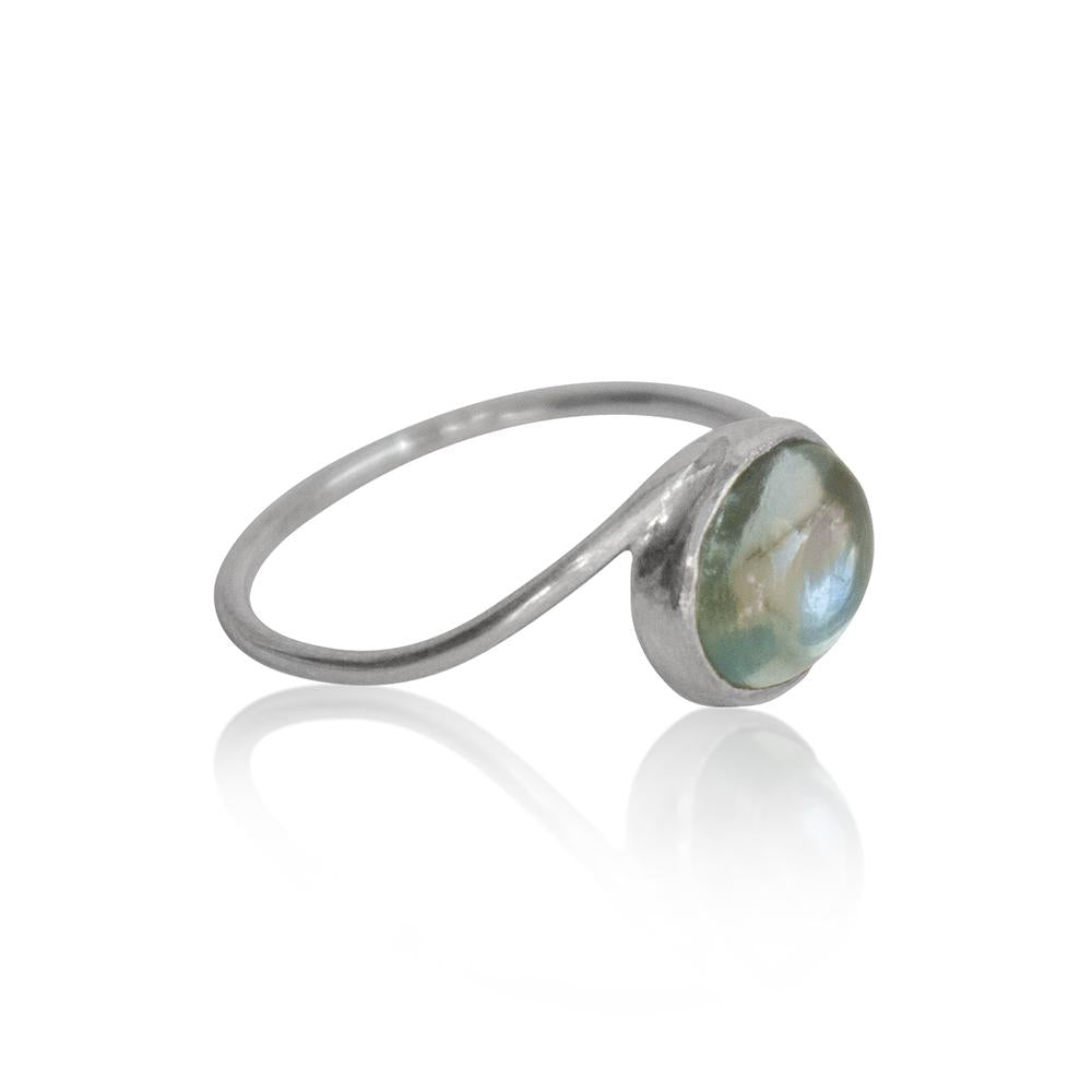 Sterling silver aquamarine oval twist ring from Grey Clymene featuring a polished blue gemstone setting.