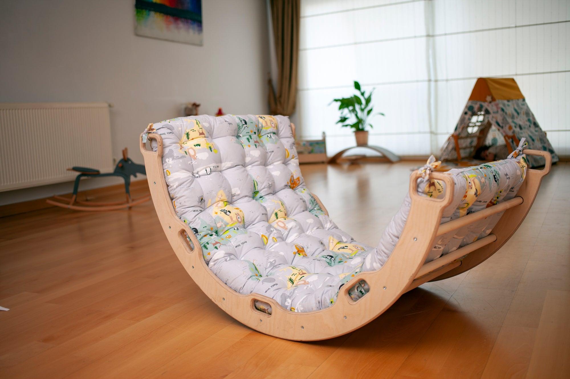 Red Oceanus climbing arch rocker with a colorful map pattern pillow, designed for children&
