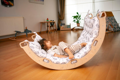 Red Oceanus climbing arch with origami pattern pillow, modern furniture piece featuring a curved design and decorative cushion.