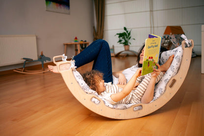 Red Oceanus climbing arch with origami patterned pillow, modern furniture piece featuring a curved design and decorative cushion.