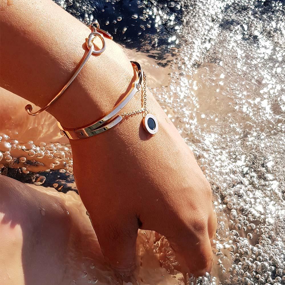 White Poppy Jericho Rosé Gold bracelet featuring a sleek, elegant design with a smooth band and subtle gold finish.