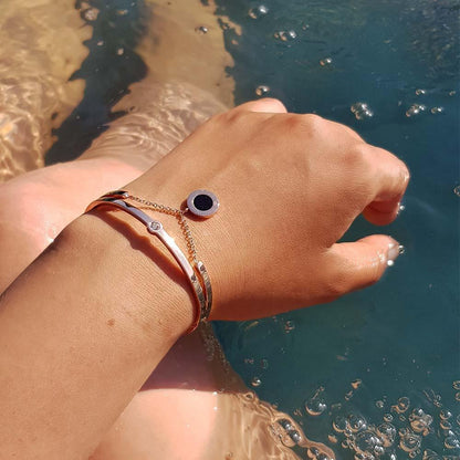 White Poppy Jericho Rosé gold bracelet with a sleek, elegant design, featuring a delicate chain and minimalist style.