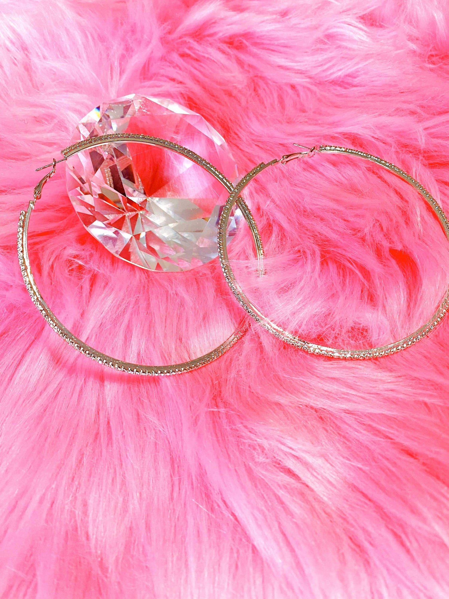 Burgundy Uranus hoop earrings, Around The Way Girl style, featuring bold circular design for a trendy accessory look.
