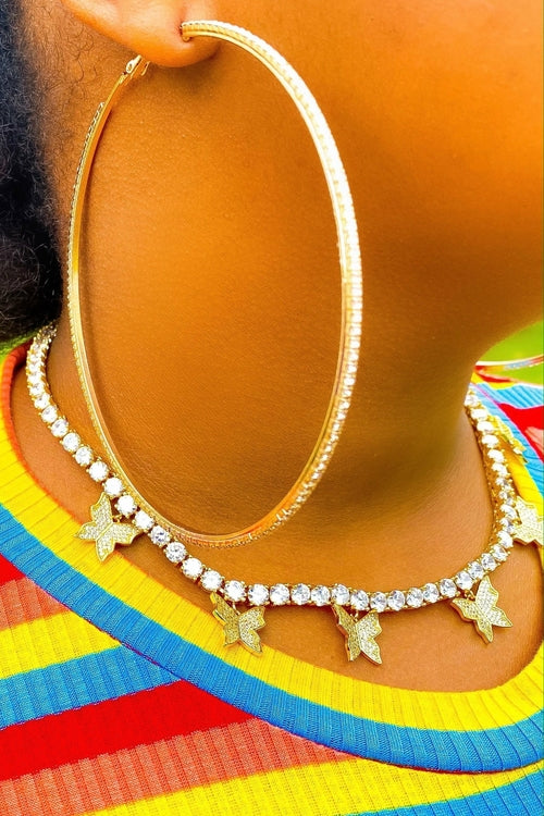 Burgundy Uranus hoop earrings titled "Around The Way Girl," round gold-tone earrings with a stylish and trendy design.