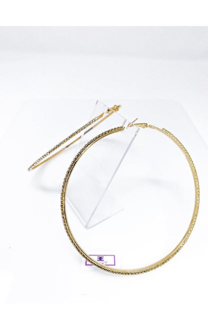 Burgundy Uranus hoop earrings called Around The Way Girl, featuring large gold-tone hoops with stylish design details.