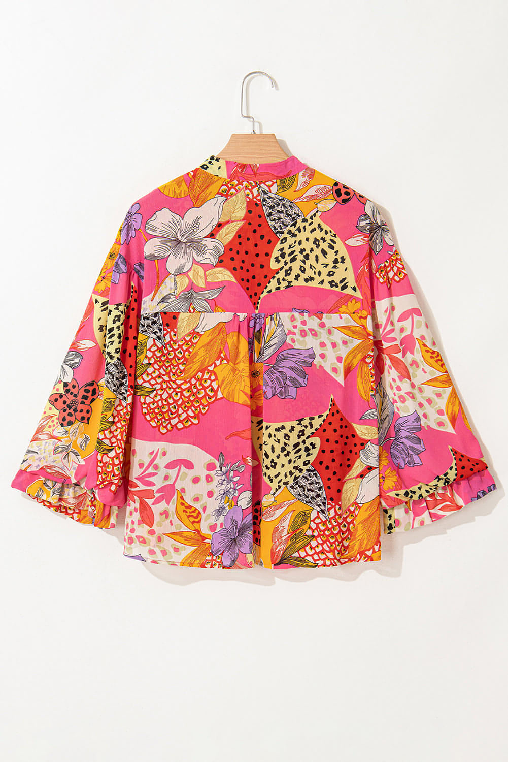 Red abstract floral print blouse with ruffled bubble sleeves and button details by Carmine Juneberry, stylish tops and blouses.