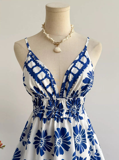 Floral print V-neck mini dress by Pear Daisy, featuring a colorful floral pattern and a stylish V-neck design.