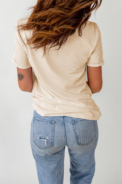 Carmine Juneberry khaki Western poker cards graphic T-shirt featuring a bold poker card design on the front.