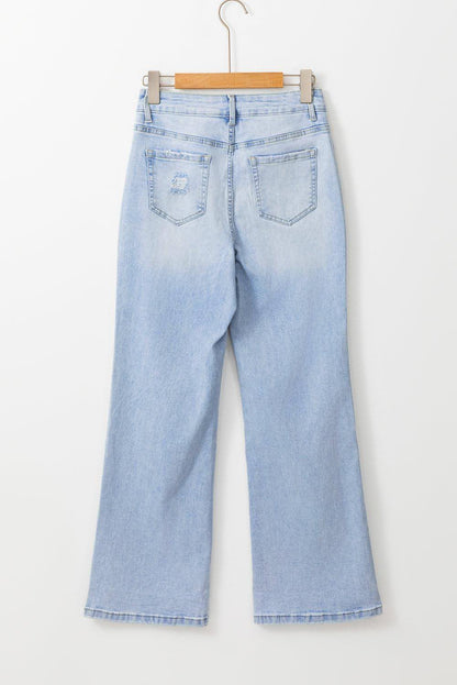 Carmine Juneberry Beau Blue vintage light wash distressed flare jeans showing frayed hems and classic five-pocket style.