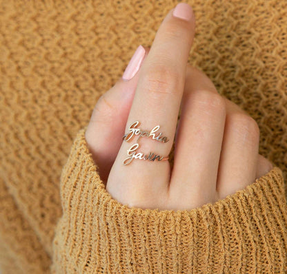 Custom Pink Lucky Name Ring in jewelry, featuring personalized gold lettering on a sleek band.