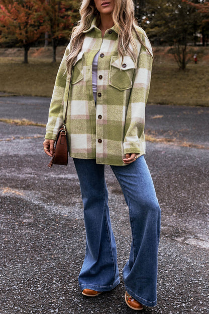 Sage green plaid print Carmine Juneberry shacket with buttoned flap pockets, oversized fit, and casual style.