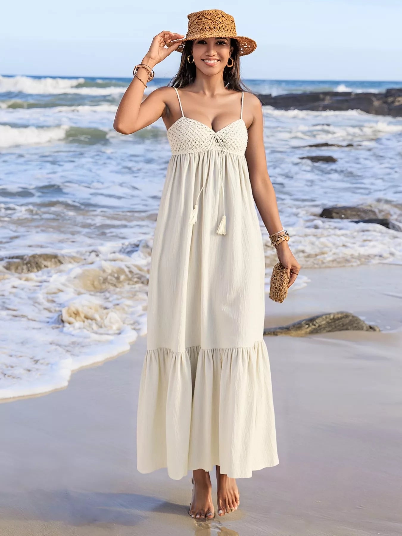 Pear Daisy sweetheart neck spaghetti strap dress hanging on a wooden hanger in a cozy home setting