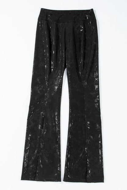 Black faux leather splits high waist leggings by Carmine Juneberry, showing the sleek, fitted design with split details at the hem.