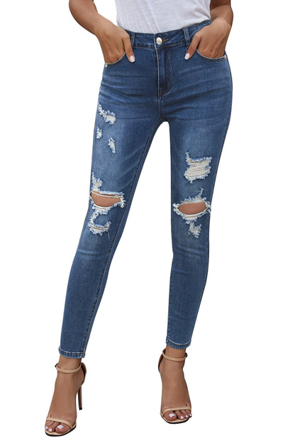 Blue hollow-out vintage skinny ripped jeans by Harlequin Daisy, showcasing distressed denim and slim fit design.