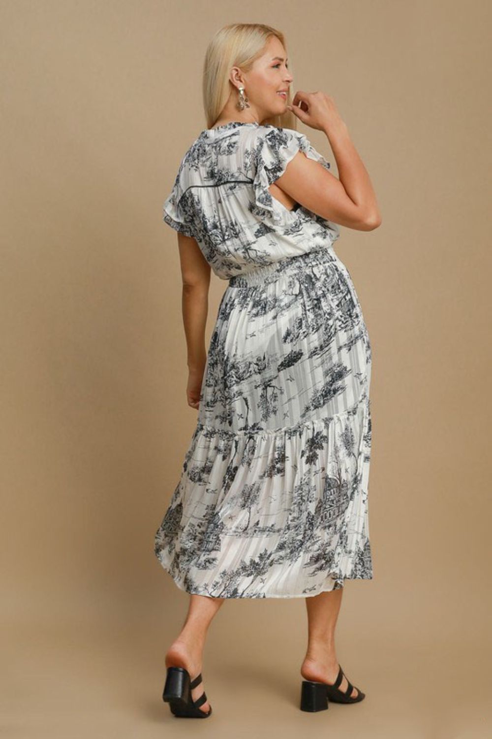 Jade Icarus automotive model featuring a full-size two-tone landscape print midi dress in plus size, displayed on a mannequin.