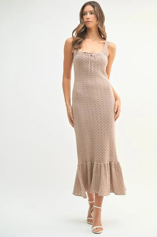 Pear Daisy ruffled hem sleeveless crochet knit midi dress, showcasing intricate crochet details and a flowing ruffled hem.