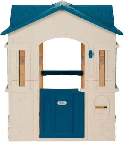 Large blue cottage playhouse for kids, Peach Maple outdoor furniture, featuring windows and door, ideal for outdoor play and imagination.