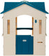 Large blue cottage playhouse for kids, Peach Maple outdoor furniture, featuring windows and door, ideal for outdoor play and imagination.