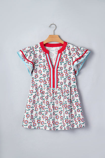 Byzantium Bay floral contrast trim V-neck flutter sleeve blouse for women, with vibrant floral pattern and stylish design.