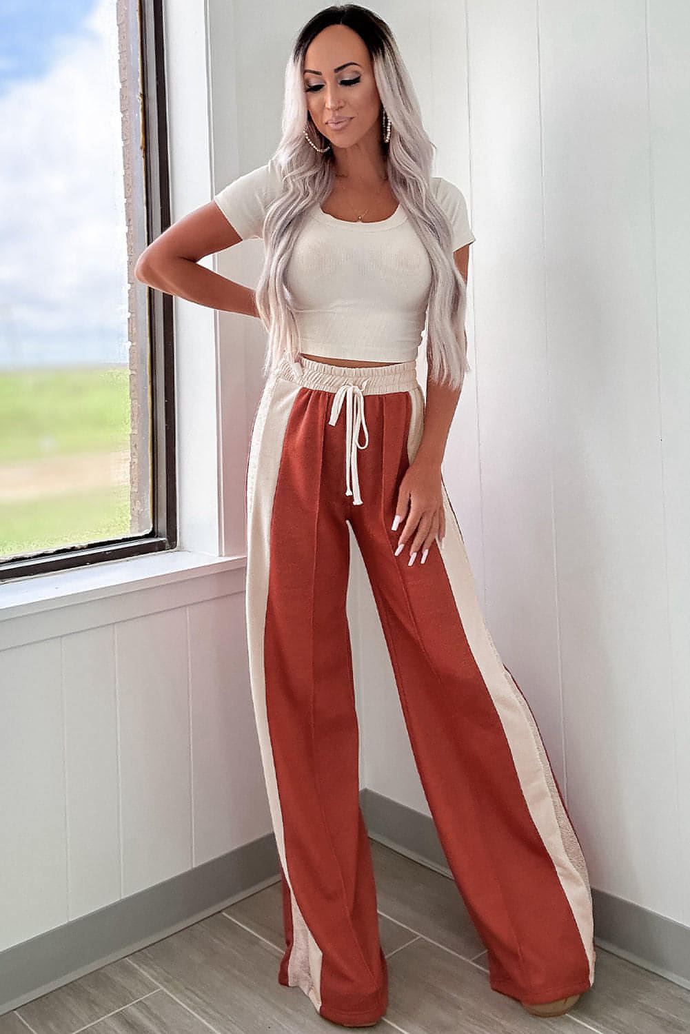 Carmine Juneberry flamingo color block high waist drawstring wide-leg pants displayed on a model.