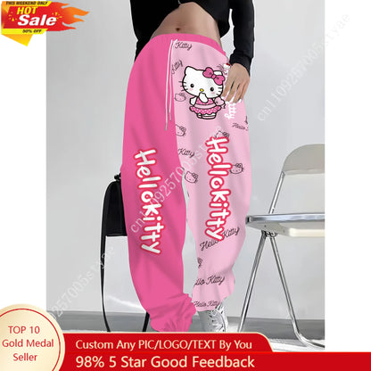 Hot pink and light pink split-color Hello Kitty long pants with cartoon polka-dot bow print, stylish apparel for women by Start2Finish.
