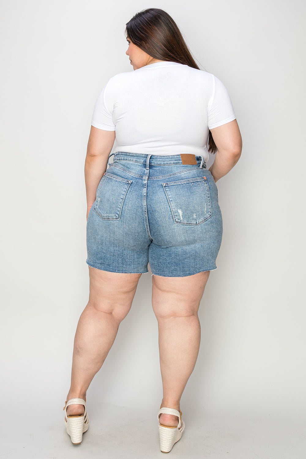 Judy Blue high waist denim shorts with rhinestone decoration, styled as fashionable casual wear, displayed on a plain background.
