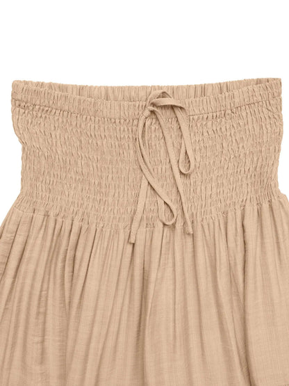 Rust-colored smocked tiered skirt for women by Ruby Styx, featuring a flowy, layered design and elastic waistband.