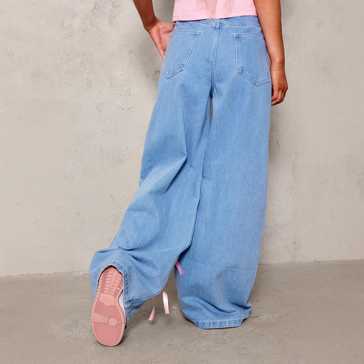 Carmine Juneberry Bow High Waist Wide Leg Jeans in blue denim with a bow detail at the waist, showcasing a trendy wide-leg fit.