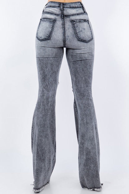 Grey Storm Bell Bottom Jean by Jade Icarus, featuring high-waisted fit and flared leg design, shown on a model.