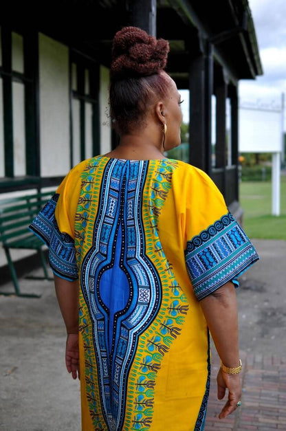 White Baobab African Dashiki dress, long kaftan-style T-shirt with vibrant traditional African print and relaxed fit.