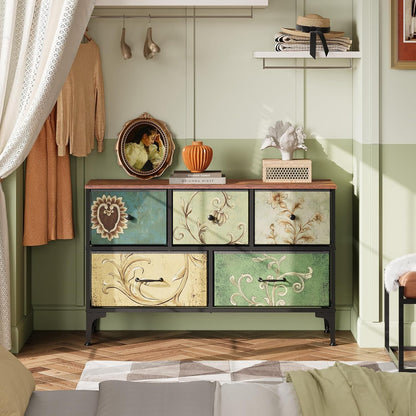 Peach Maple floral painted dresser with five drawers and fabric bins, showcasing colorful floral design and storage space.