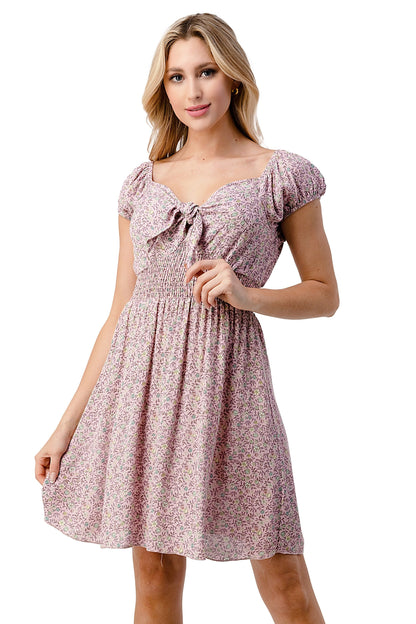 Daisy floral Emma dress by Indigo Arrowwood featuring bow tie front, cap sleeves, and a feminine, flowy silhouette for women&