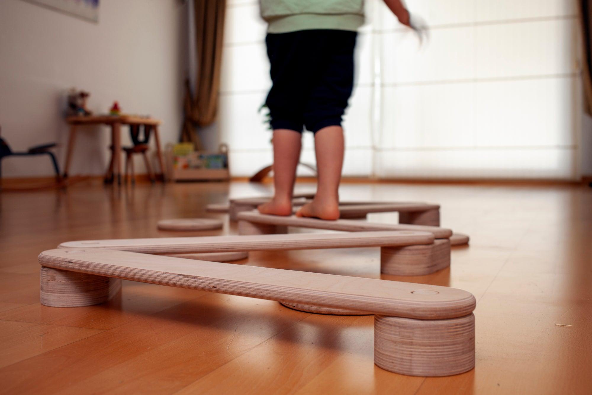 Red Oceanus circular wooden balance beam set for furniture, featuring smooth wooden surfaces and sturdy construction for stable use.
