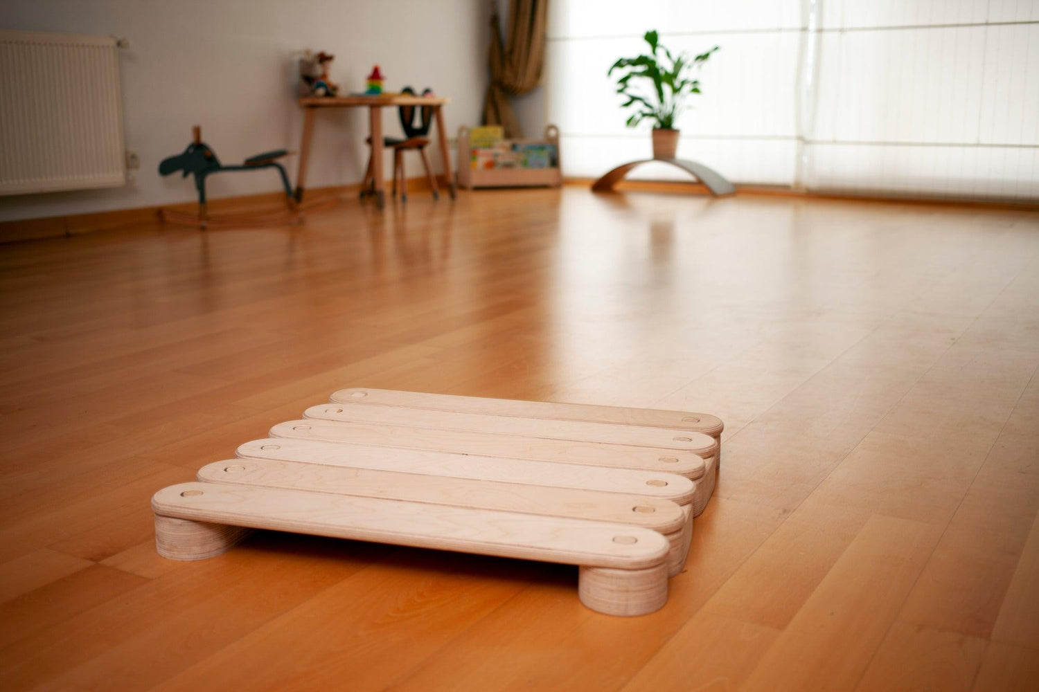 Red Oceanus circular wooden balance beam set for furniture, featuring smooth, natural wood finish and sturdy construction for indoor use.