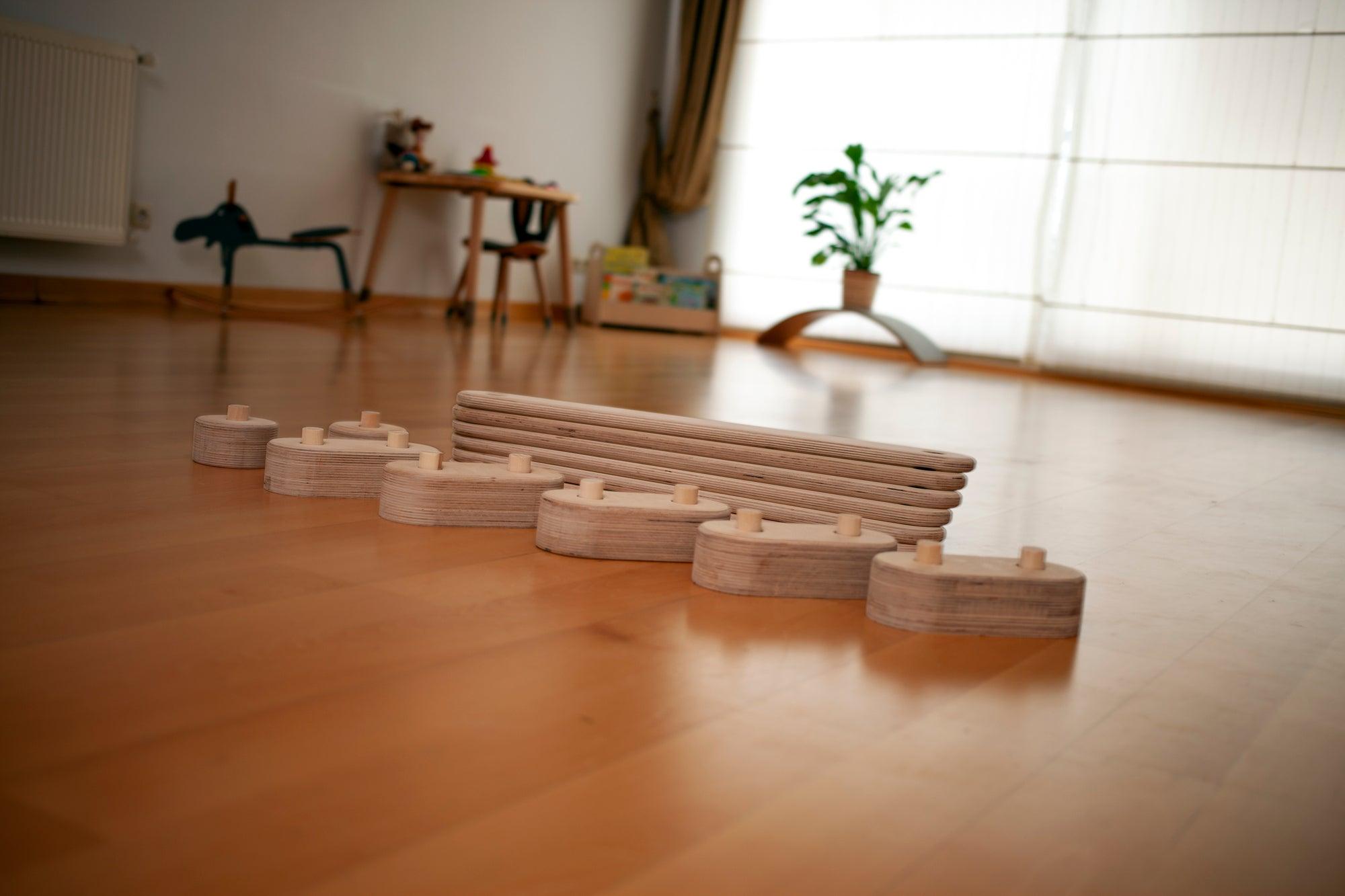 Red Oceanus circular wooden balance beam set for furniture, featuring natural wood finish and round, smooth design for stability and style.