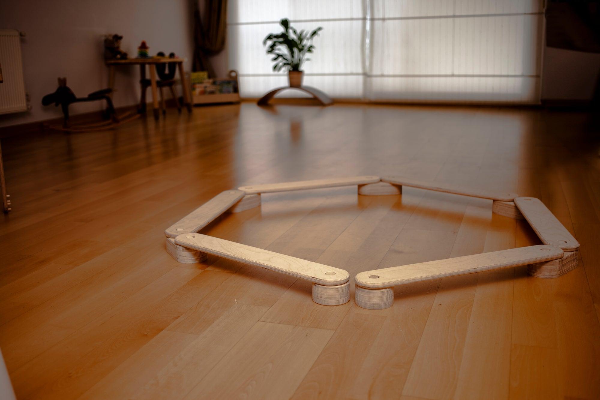 Red Oceanus circular wooden balance beam set for furniture, featuring smooth wooden surfaces and circular design for stability and style.