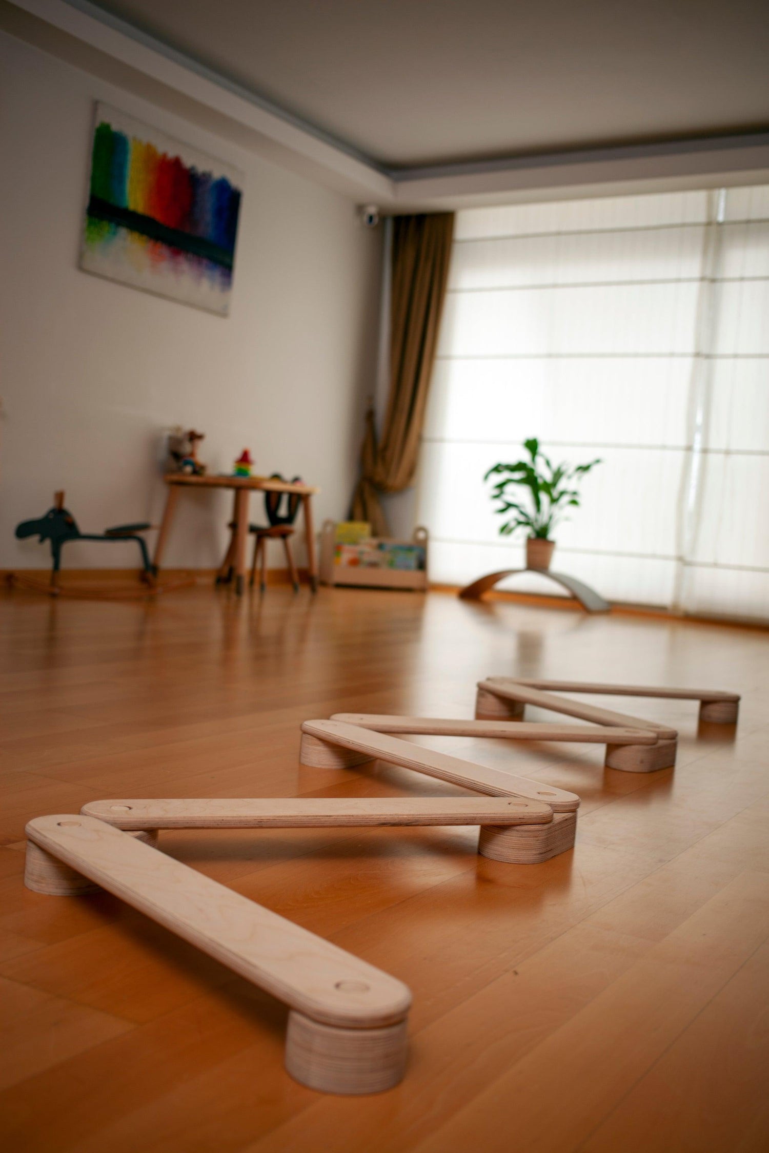 Red Oceanus circular wooden balance beam set for kids, featuring smooth, natural wood surfaces and durable construction.