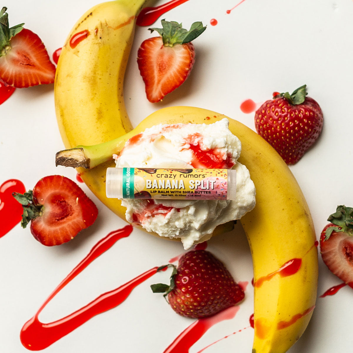 Orchid Nyx Banana Split Lip Balm in a makeup product image showing the colorful, banana-themed lip balm tube.