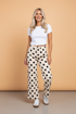 Women’s polka dot wide-leg ankle-length jeans by Byzantium Bay featuring a relaxed fit and playful pattern.