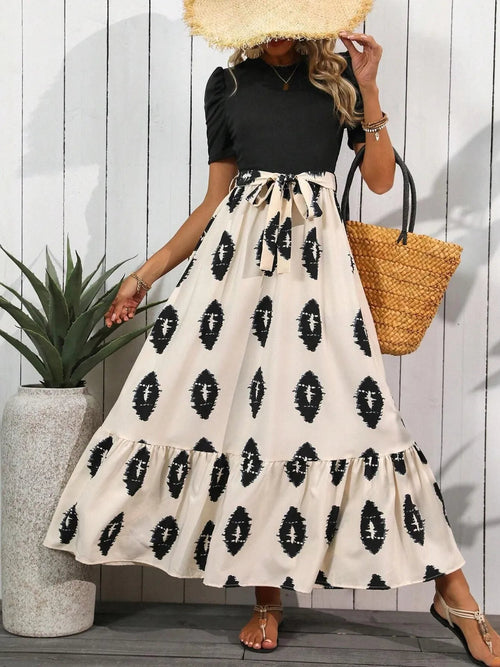 Printed tie waist maxi dress for women by Ruby Styx, featuring short sleeves and a flowing silhouette.