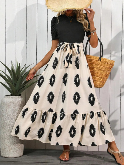 Printed tie waist maxi dress for women by Ruby Styx, featuring short sleeves and a flowing silhouette.