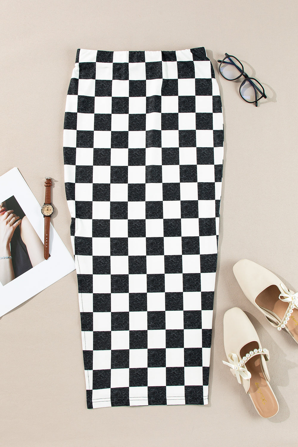 Byzantium Bay checker side slit high waist midi skirt worn by a woman, showcasing its stylish pattern and flowy design.