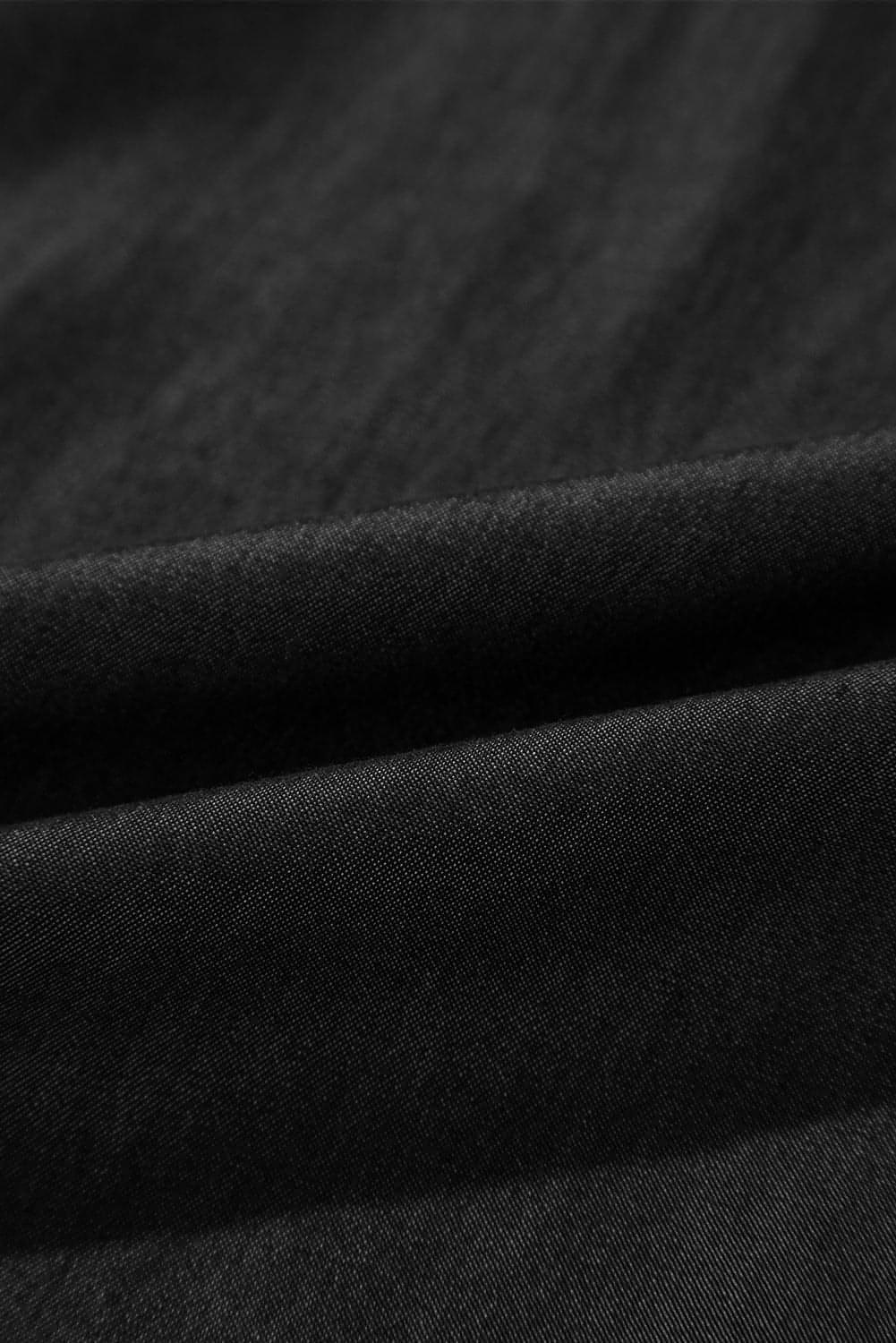 Black high waist wide leg jeans with side pockets, frilled and smocked details by Carmine Juneberry
