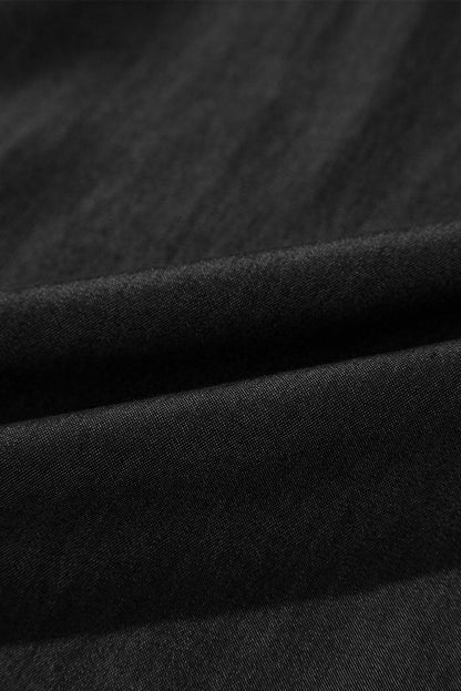 Black high waist wide leg jeans with side pockets, frilled and smocked details by Carmine Juneberry