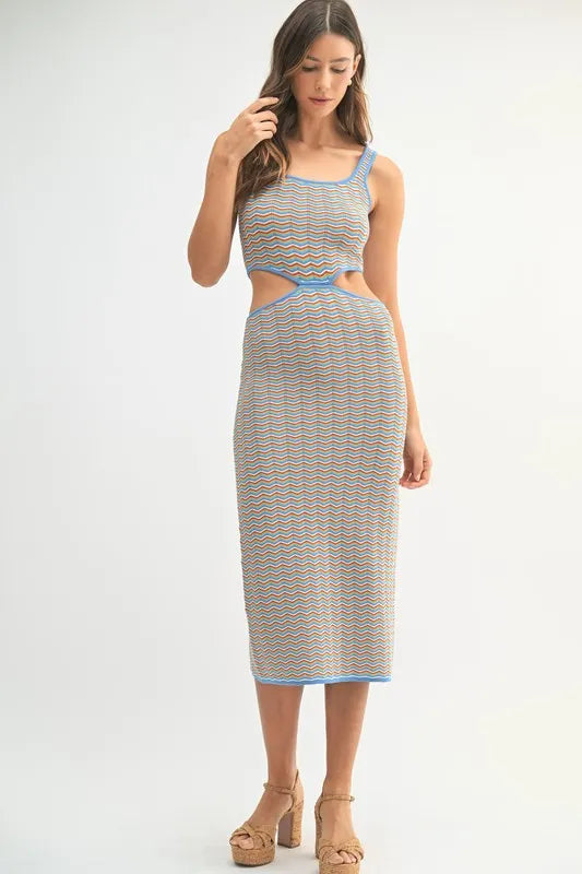 Multi-color chevron knit bodycon midi dress by Pear Daisy, featuring a fitted design and vibrant pattern.