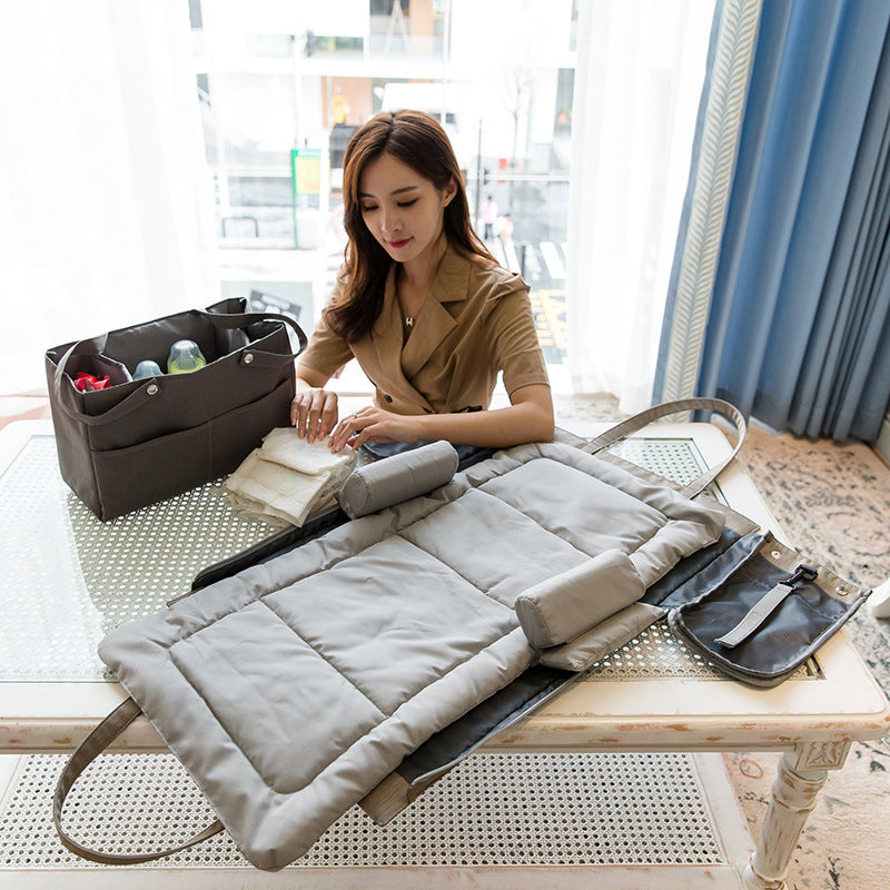 Maroon Asteria folding large capacity mother and baby bag with multiple compartments, designed for parenthood essentials.