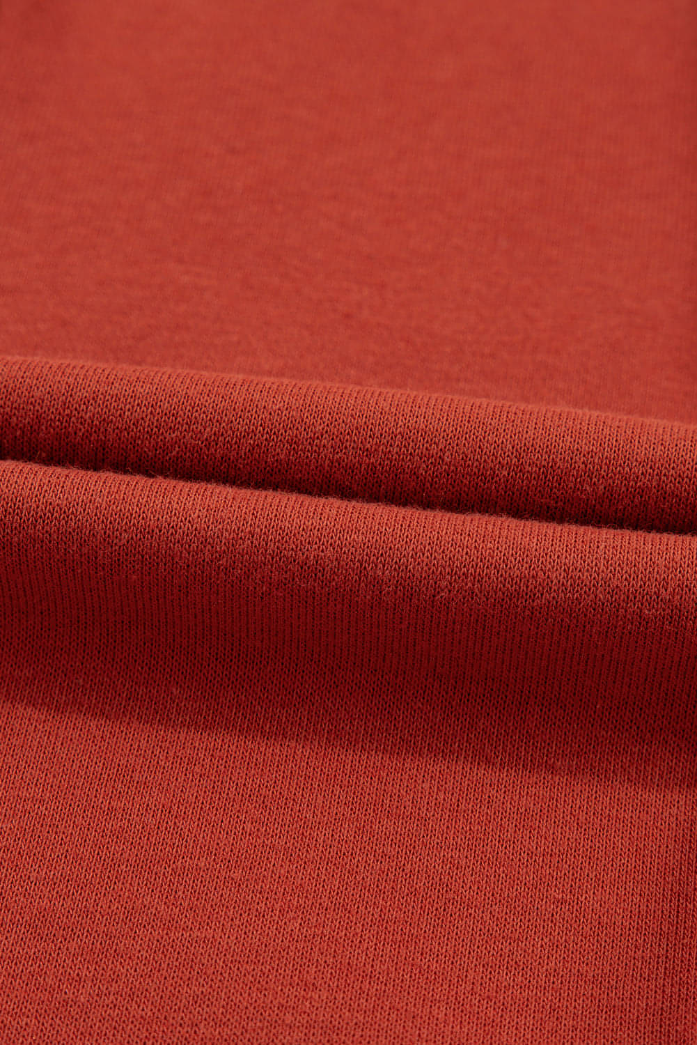 Carmine Juneberry flamingo color block drawstring high waist wide-leg pants displayed on a bed.