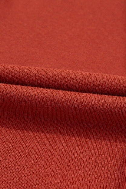 Carmine Juneberry flamingo color block drawstring high waist wide-leg pants displayed on a bed.