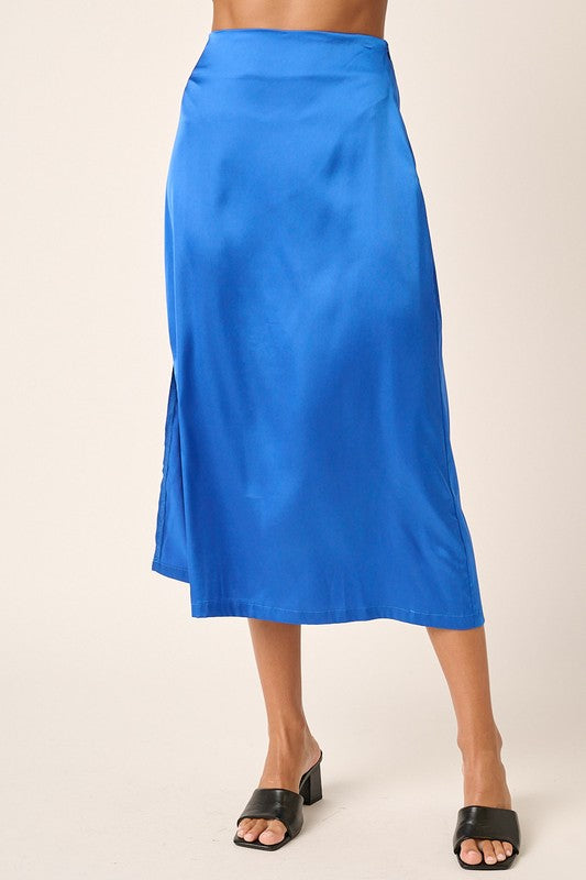Jade Icarus Mittoshop satin midi skirt with side slit, shown in a stylish fashion setting